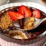 Creamy strawberry chocolate overnight oats with magic shell topping in jar